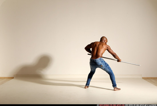 Man Adult Athletic Black Fighting with spear Moving poses Pants