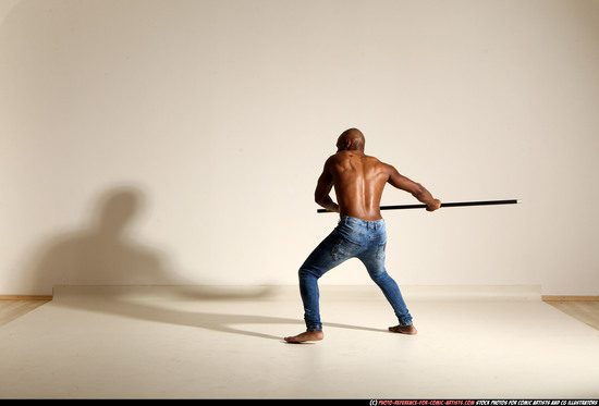 Man Adult Athletic Black Fighting with spear Moving poses Pants