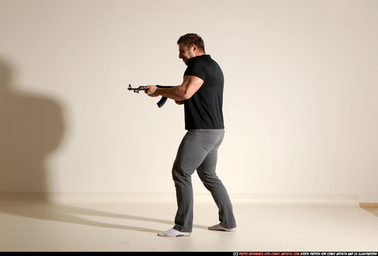 Man Adult Muscular White Fighting with submachine gun Moving poses Casual