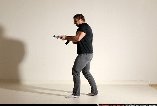 Man Adult Muscular White Fighting with submachine gun Moving poses Casual