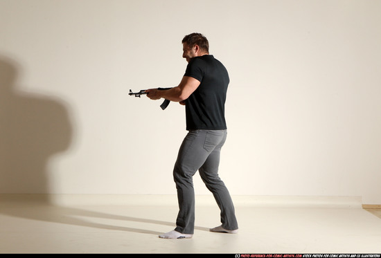 Man Adult Muscular White Fighting with submachine gun Moving poses Casual