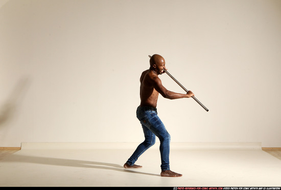 Man Adult Athletic Black Fighting with spear Moving poses Pants