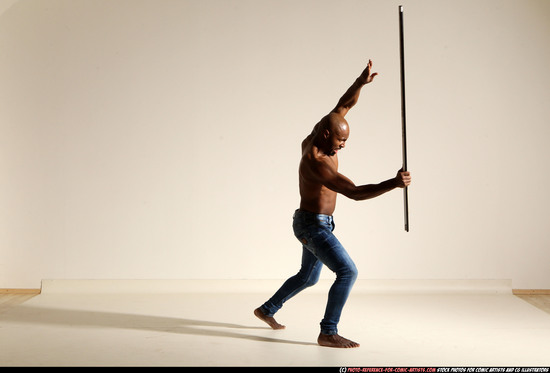 Man Adult Athletic Black Fighting with spear Moving poses Pants