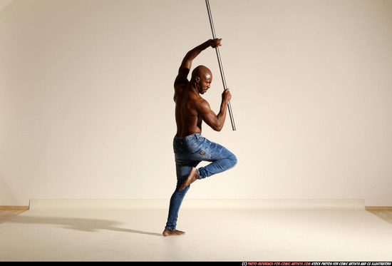 Man Adult Athletic Black Fighting with spear Moving poses Pants