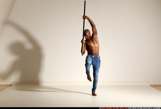 Man Adult Athletic Black Fighting with spear Moving poses Pants