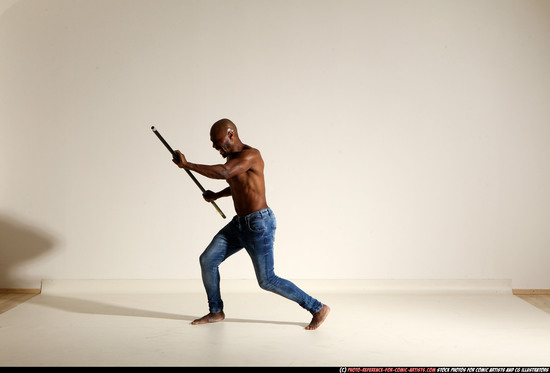 Man Adult Athletic Black Fighting with spear Moving poses Pants