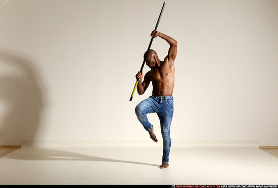 Man Adult Athletic Black Fighting with spear Moving poses Pants