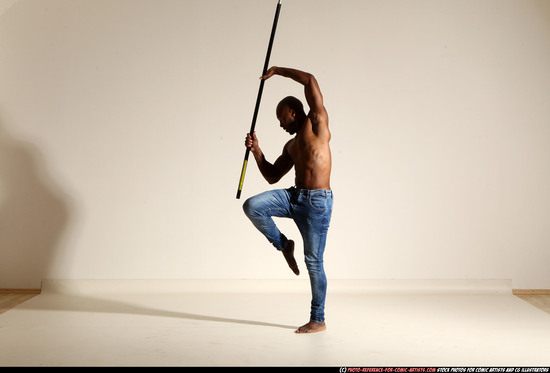 Man Adult Athletic Black Fighting with spear Moving poses Pants