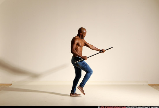 Man Adult Athletic Black Fighting with spear Moving poses Pants