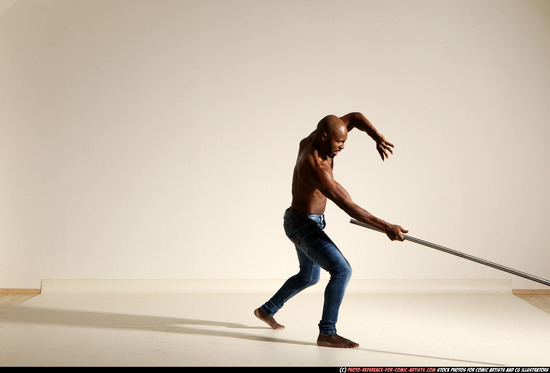 Man Adult Athletic Black Fighting with spear Moving poses Pants