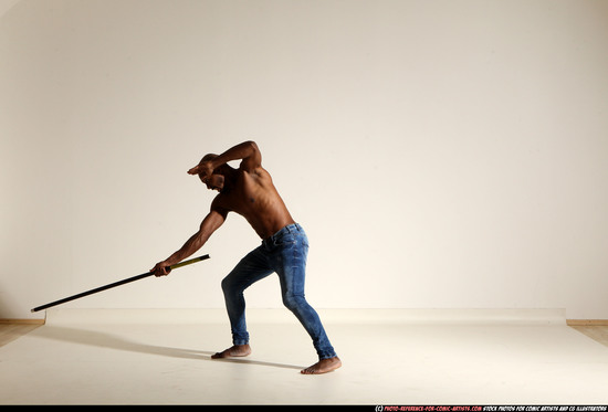 Man Adult Athletic Black Fighting with spear Moving poses Pants