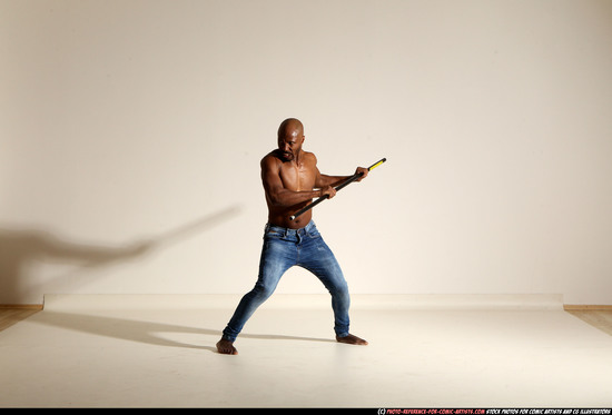 Man Adult Athletic Black Fighting with spear Moving poses Pants