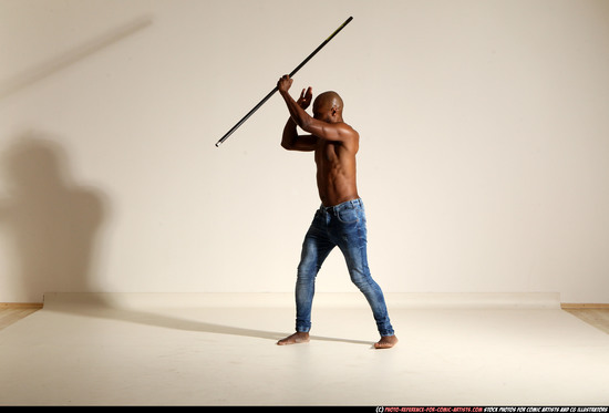 Man Adult Athletic Black Fighting with spear Moving poses Pants