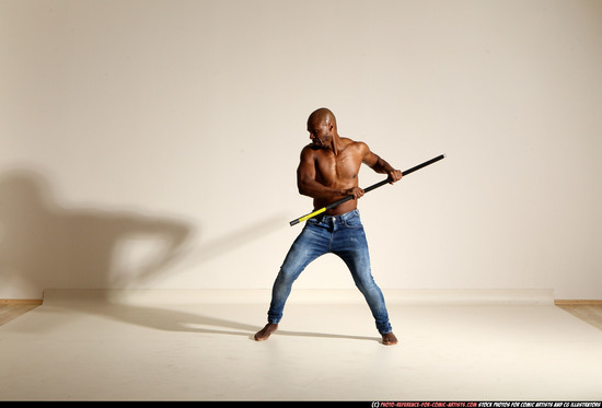 Man Adult Athletic Black Fighting with spear Moving poses Pants