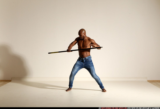 Man Adult Athletic Black Fighting with spear Moving poses Pants