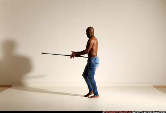 Man Adult Athletic Black Fighting with spear Moving poses Pants