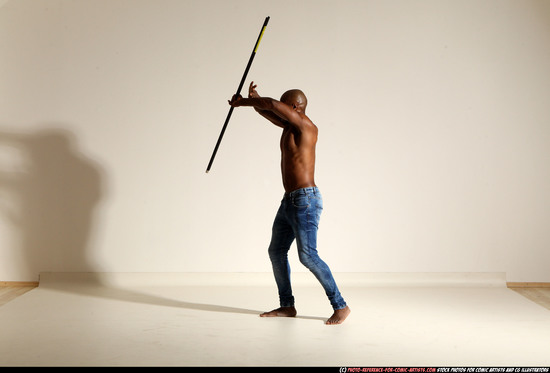 Man Adult Athletic Black Fighting with spear Moving poses Pants