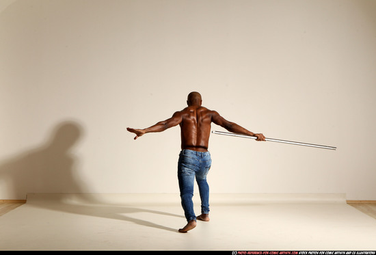 Man Adult Athletic Black Fighting with spear Moving poses Pants