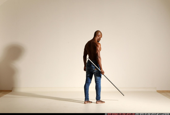 Man Adult Athletic Black Fighting with spear Moving poses Pants