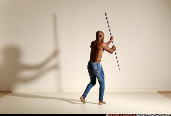 Man Adult Athletic Black Fighting with spear Moving poses Pants