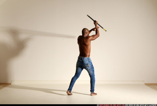 Man Adult Athletic Black Fighting with spear Moving poses Pants