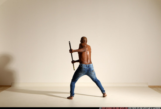 Man Adult Athletic Black Fighting with spear Moving poses Pants