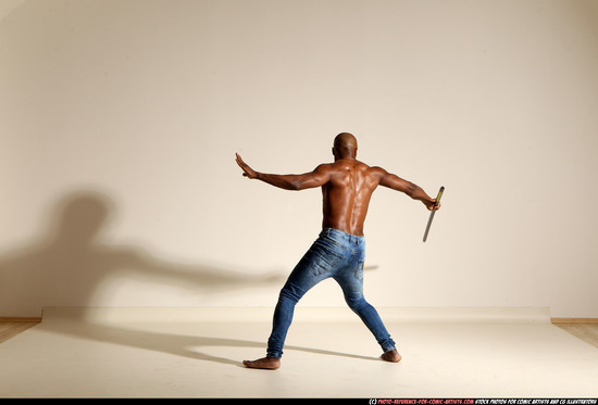 Man Adult Athletic Black Fighting with spear Moving poses Pants