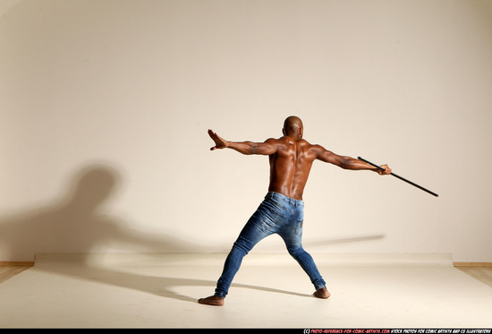 Man Adult Athletic Black Fighting with spear Moving poses Pants