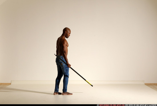 Man Adult Athletic Black Fighting with spear Moving poses Pants