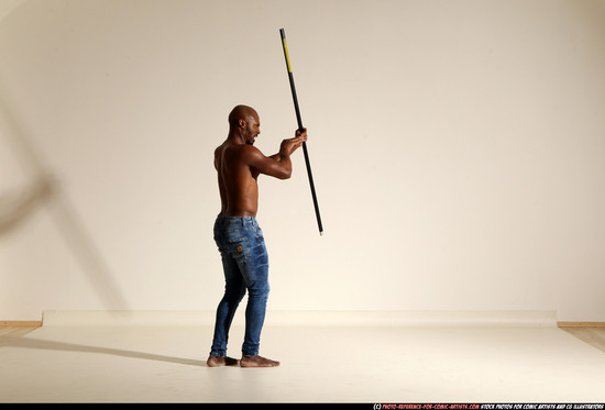 Man Adult Athletic Black Fighting with spear Moving poses Pants