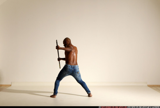 Man Adult Athletic Black Fighting with spear Moving poses Pants