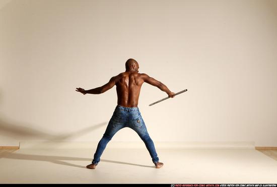 Man Adult Athletic Black Fighting with spear Moving poses Pants