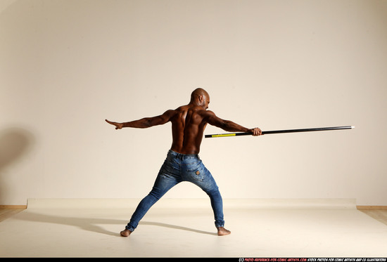 Man Adult Athletic Black Fighting with spear Moving poses Pants