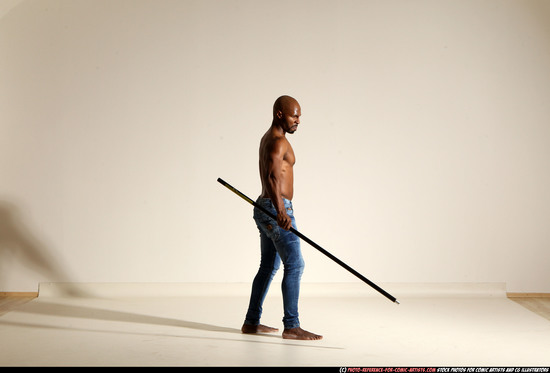 Man Adult Athletic Black Fighting with spear Moving poses Pants