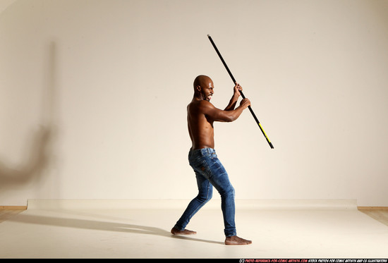 Man Adult Athletic Black Fighting with spear Moving poses Pants