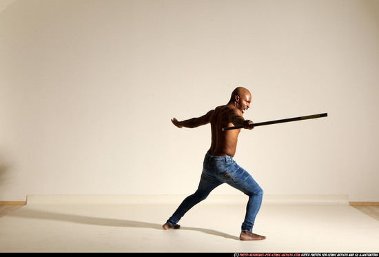 Man Adult Athletic Black Fighting with spear Moving poses Pants