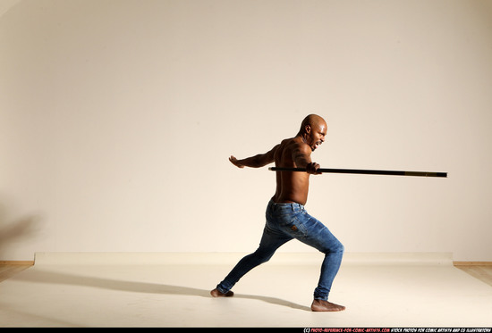 Man Adult Athletic Black Fighting with spear Moving poses Pants