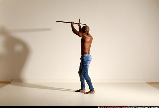 Man Adult Athletic Black Fighting with spear Moving poses Pants