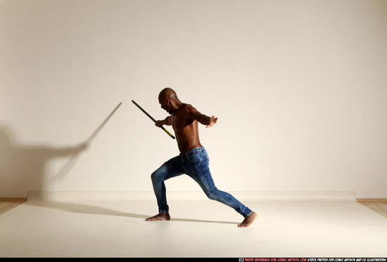 Man Adult Athletic Black Fighting with spear Moving poses Pants