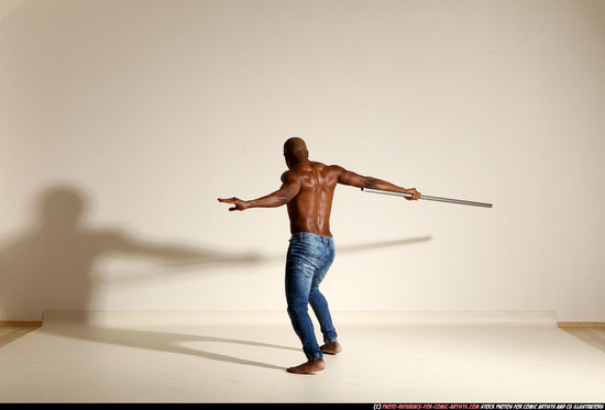 Man Adult Athletic Black Fighting with spear Moving poses Pants