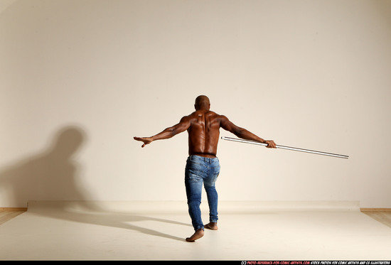 Man Adult Athletic Black Fighting with spear Moving poses Pants