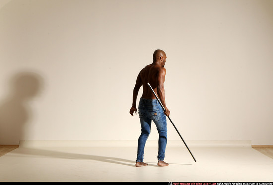 Man Adult Athletic Black Fighting with spear Moving poses Pants