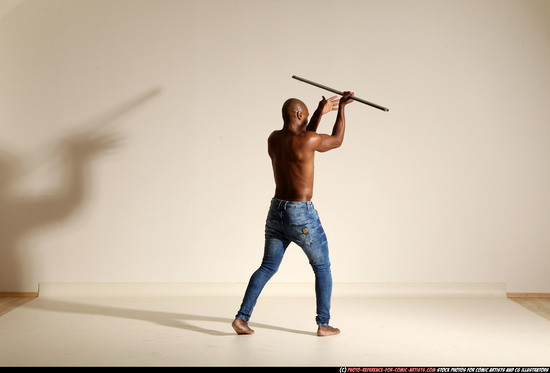 Man Adult Athletic Black Fighting with spear Moving poses Pants