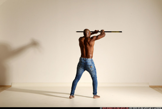 Man Adult Athletic Black Fighting with spear Moving poses Pants