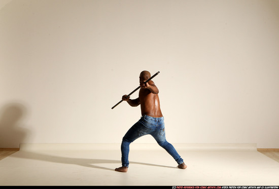 Man Adult Athletic Black Fighting with spear Moving poses Pants