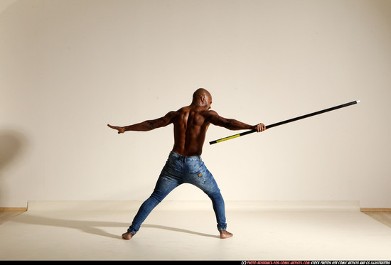 Man Adult Athletic Black Fighting with spear Moving poses Pants