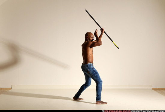 Man Adult Athletic Black Fighting with spear Moving poses Pants