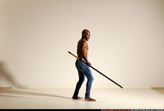 Man Adult Athletic Black Fighting with spear Moving poses Pants