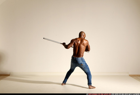 Man Adult Athletic Black Fighting with spear Moving poses Pants