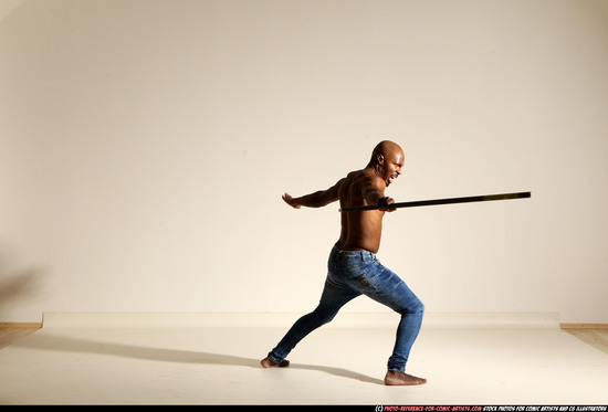 Man Adult Athletic Black Fighting with spear Moving poses Pants